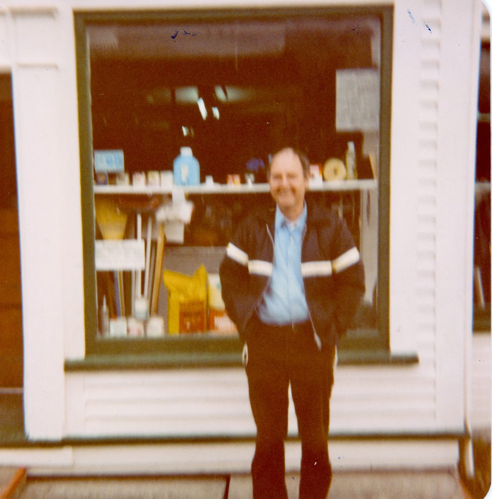Ray Norman standing outside his shop on Water Street in Bay Roberts NL - September 1983