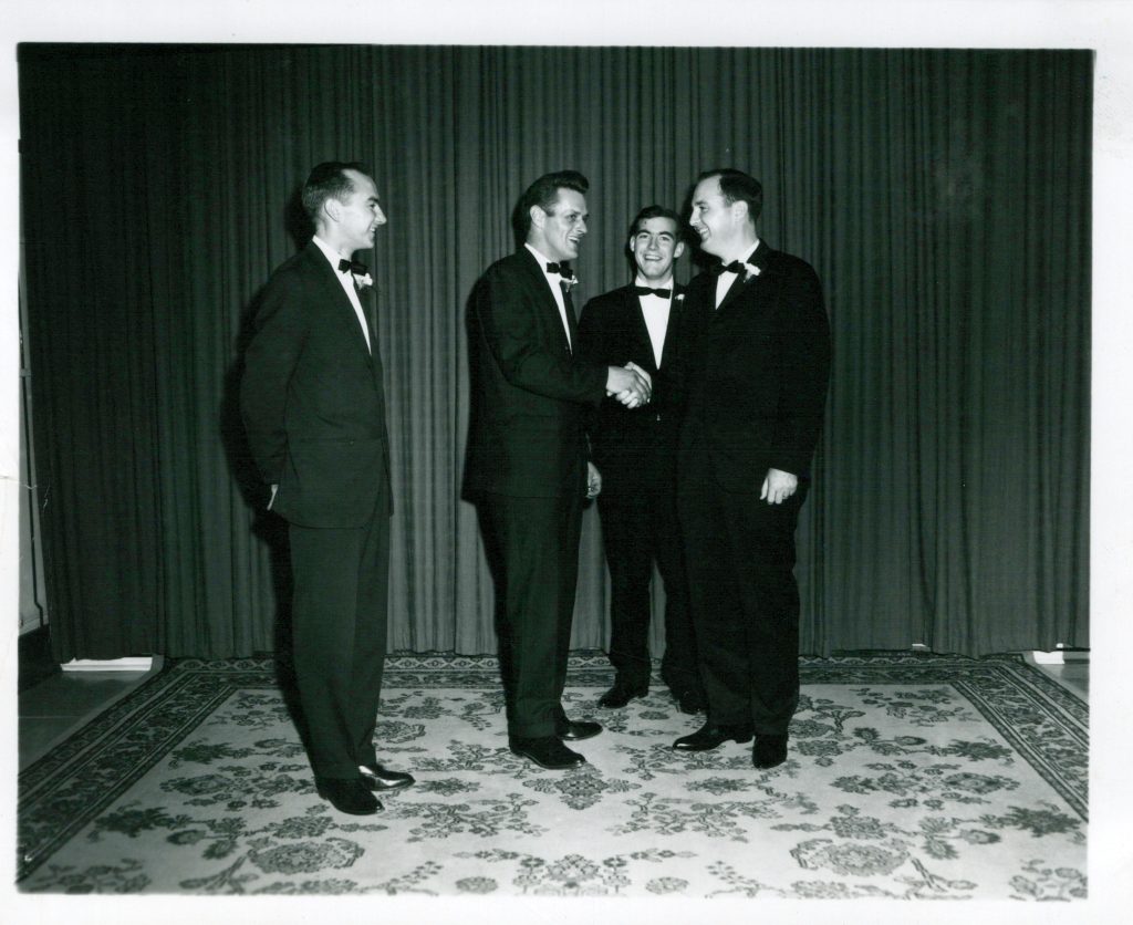 Ray Norman during wedding with groomsmen - shaking hands with Alton Churchill (1966)